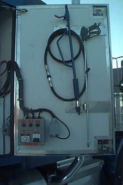 Pressure washer gun and control on inside of trailer door